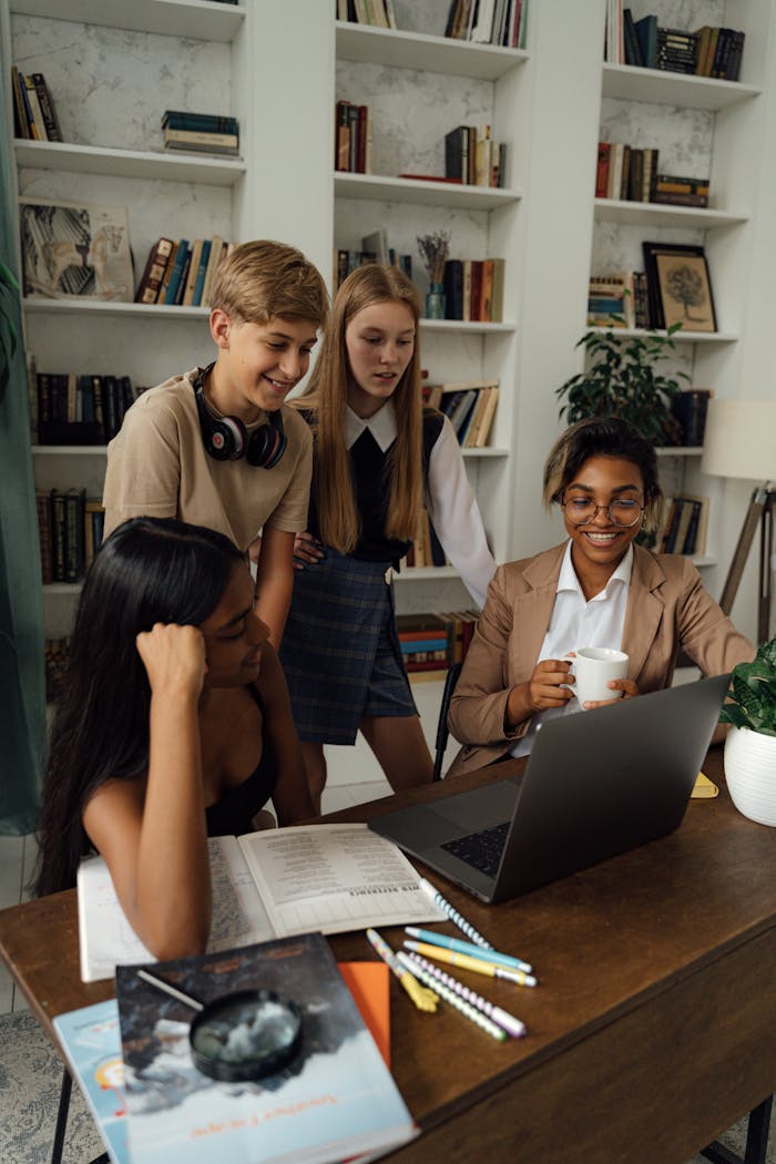 Crafting Captivating Headlines: Your awesome post title goes here Group of teenagers studying and collaborating with a teacher in a library setting.